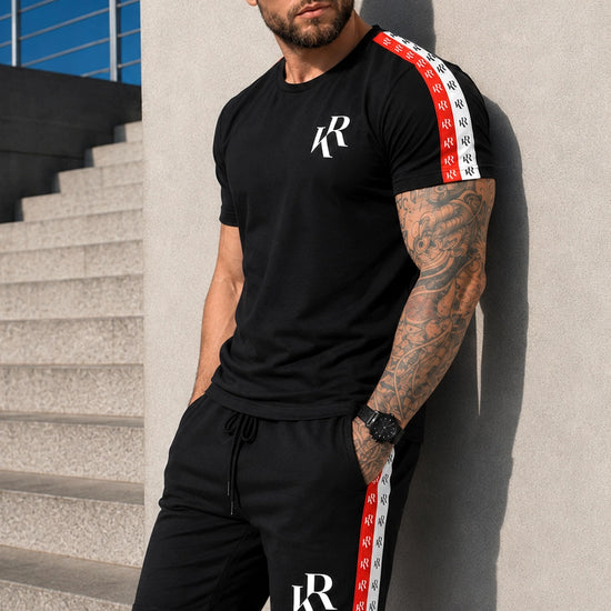 Men’s black summer set NIZZA by KRUTYAKOV with t-shirt and shorts, red and white logo tape details, styled as a premium casual outfit.