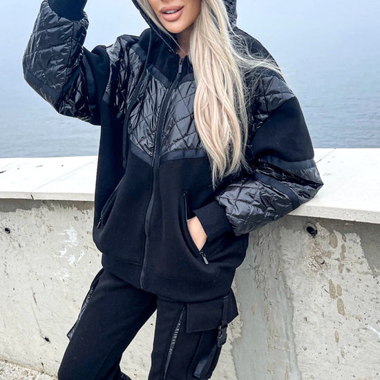 Women’s black warm tracksuit SALMA by KRUTYAKOV with glossy satin-finish coating, zip jacket, and matching jogger pants