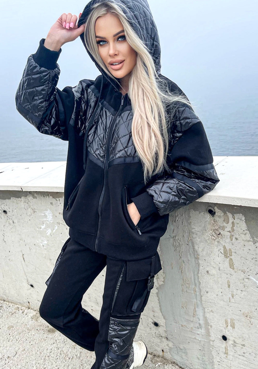 Women’s black warm tracksuit SALMA by KRUTYAKOV with glossy satin-finish coating, zip jacket, and matching jogger pants
