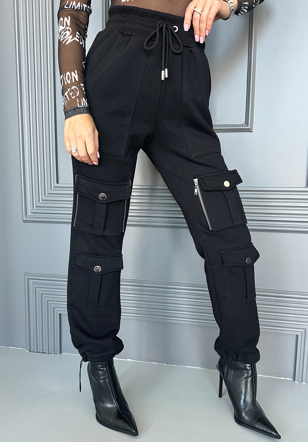 KRUTYAKOV Helen black cargo joggers with statement patch pockets, relaxed fit, and bold urban streetwear style