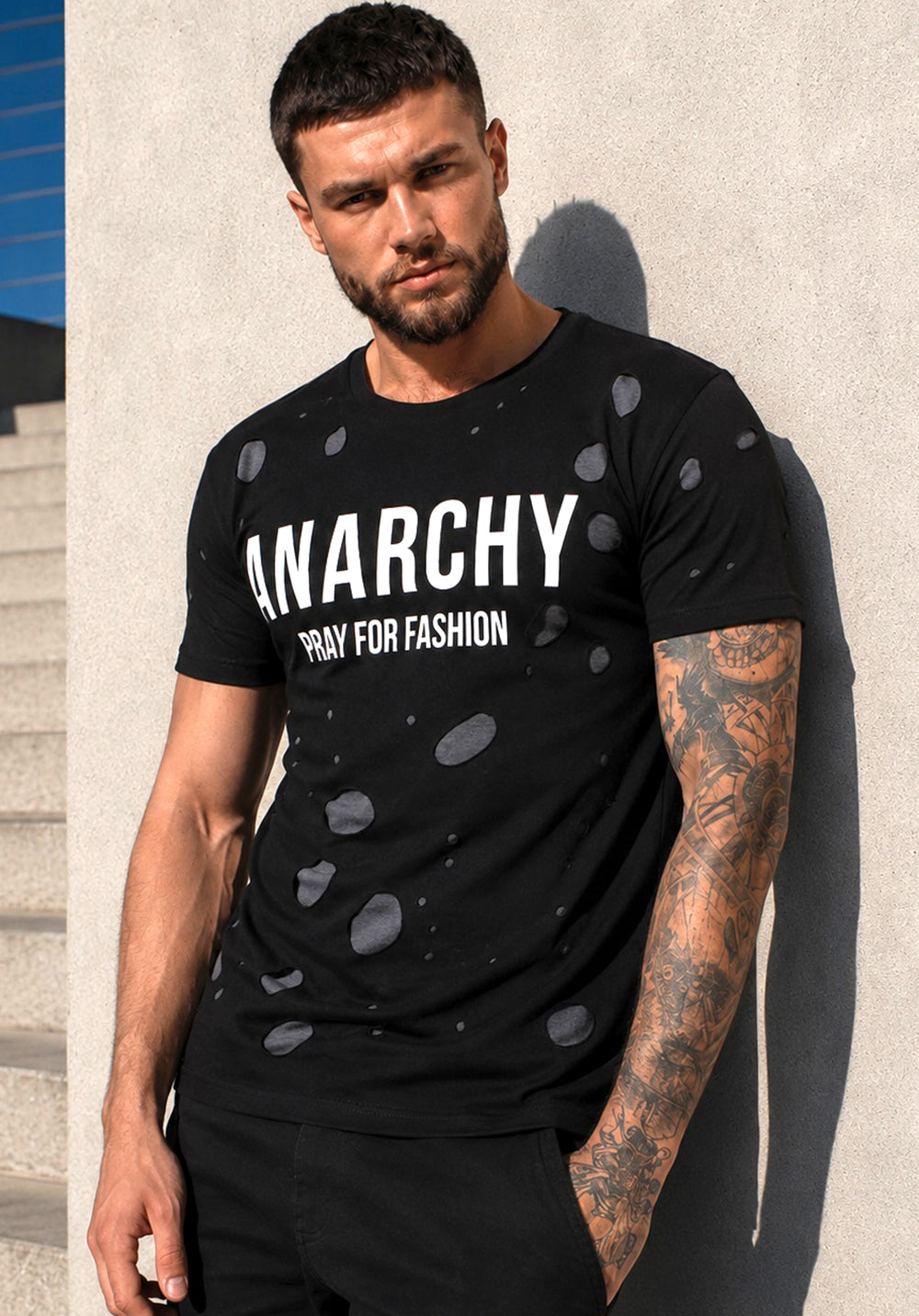 Men’s black ANARCHY designer T-shirt by KRUTYAKOV with white graphic print and cut-out details