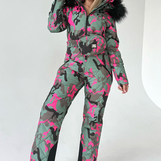 Women’s pink camo one piece ski suit VALE by KRUTYAKOV with faux fur hood and luxury après ski style