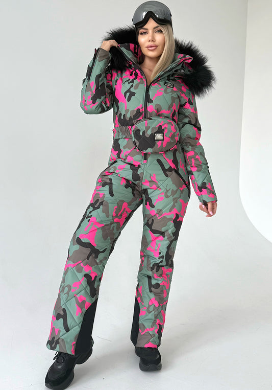 Women’s pink camo one piece ski suit VALE by KRUTYAKOV with faux fur hood and luxury après ski style