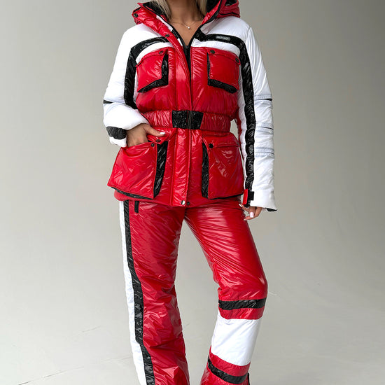 Women’s red two piece ski suit FREYA by KRUTYAKOV with glossy snow suit finish and warm insulated winter design