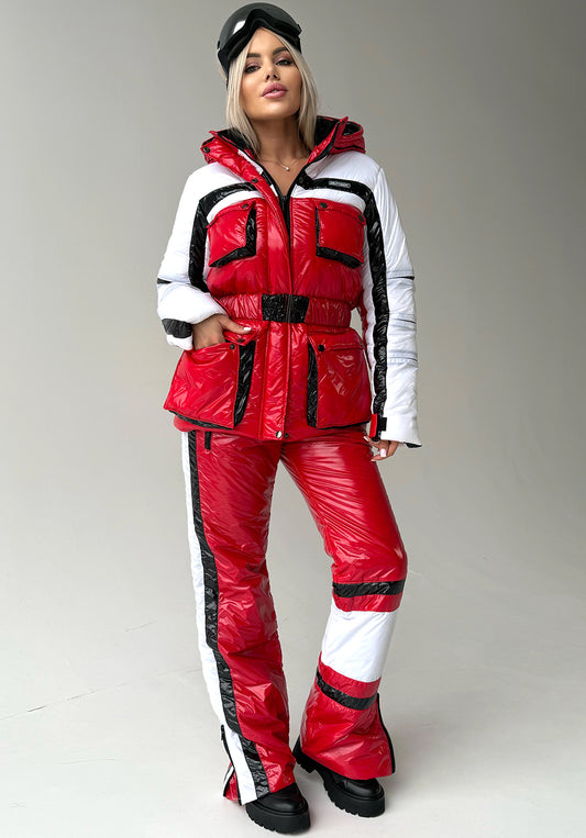 Women’s red two piece ski suit FREYA by KRUTYAKOV with glossy snow suit finish and warm insulated winter design