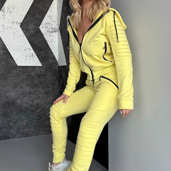 KRUTYAKOV Relief Yellow women’s knit tracksuit with bright statement color, zip hoodie, joggers, and modern streetwear look