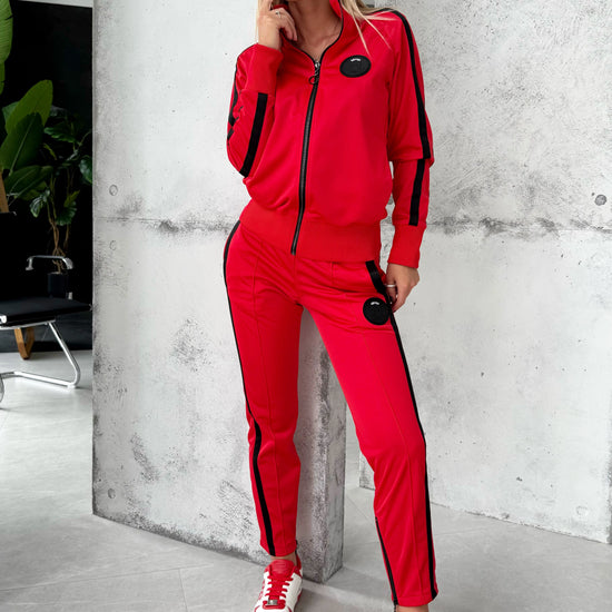 Handmade red two piece tracksuit for women with sleek athletic fit and premium designer streetwear look