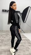 VELUREX black women’s velour tracksuit with glossy wet-look finish, zip jacket, and matching jogger pants