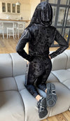 Black women’s velour jogger outfit with sleek jacket, relaxed pants, and elegant shine for elevated casual looks