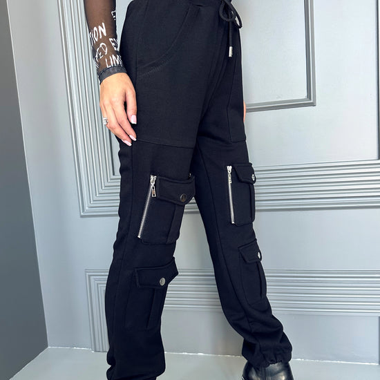 KRUTYAKOV handmade black joggers with adjustable hems, cargo pockets, and relaxed city style
