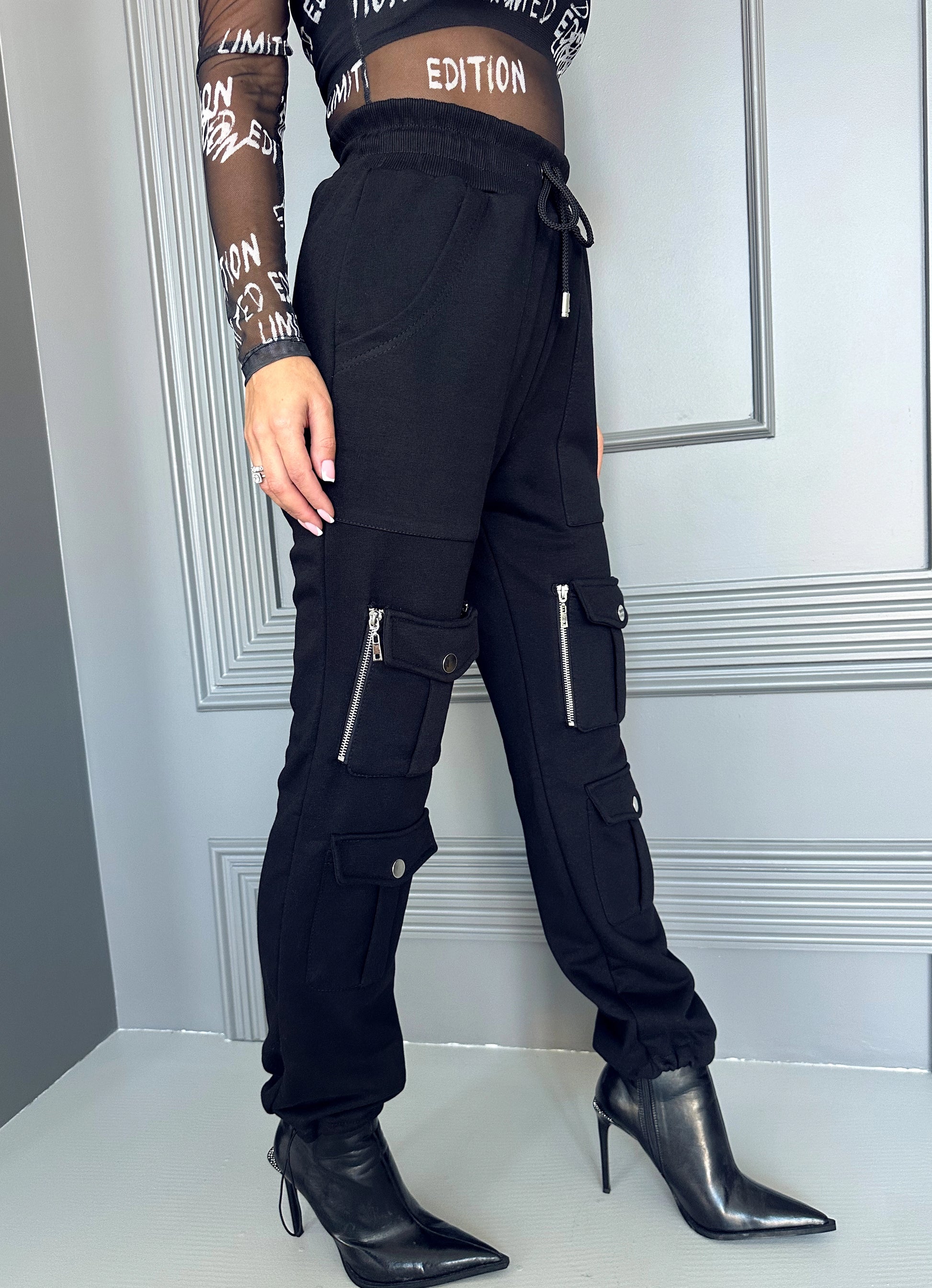 KRUTYAKOV handmade black joggers with adjustable hems, cargo pockets, and relaxed city style