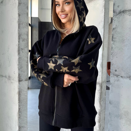 Women’s relaxed black designer hoodie styled for streetwear outfits
