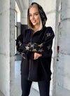 Women’s relaxed black designer hoodie styled for streetwear outfits