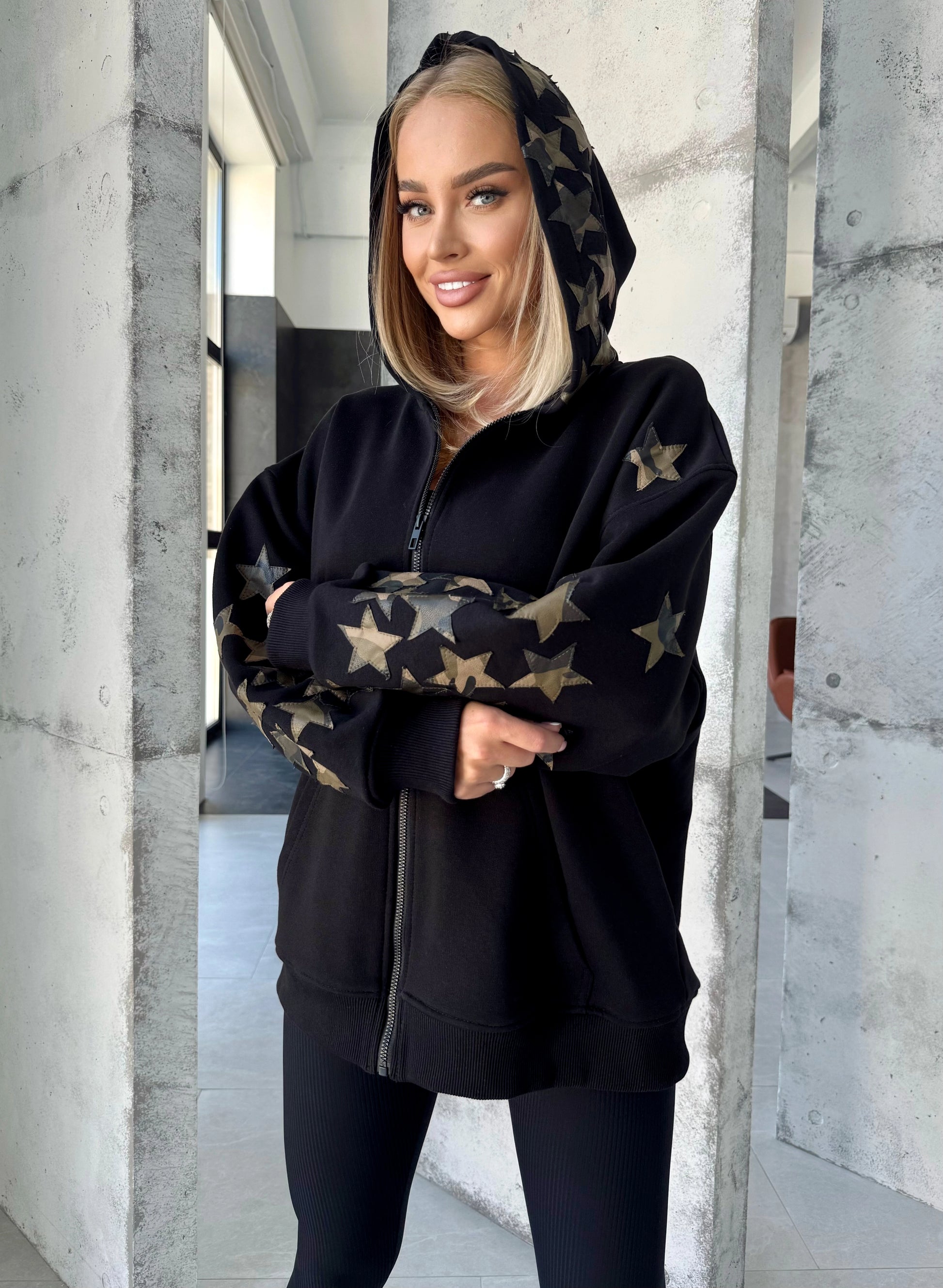 Women’s relaxed black designer hoodie styled for streetwear outfits