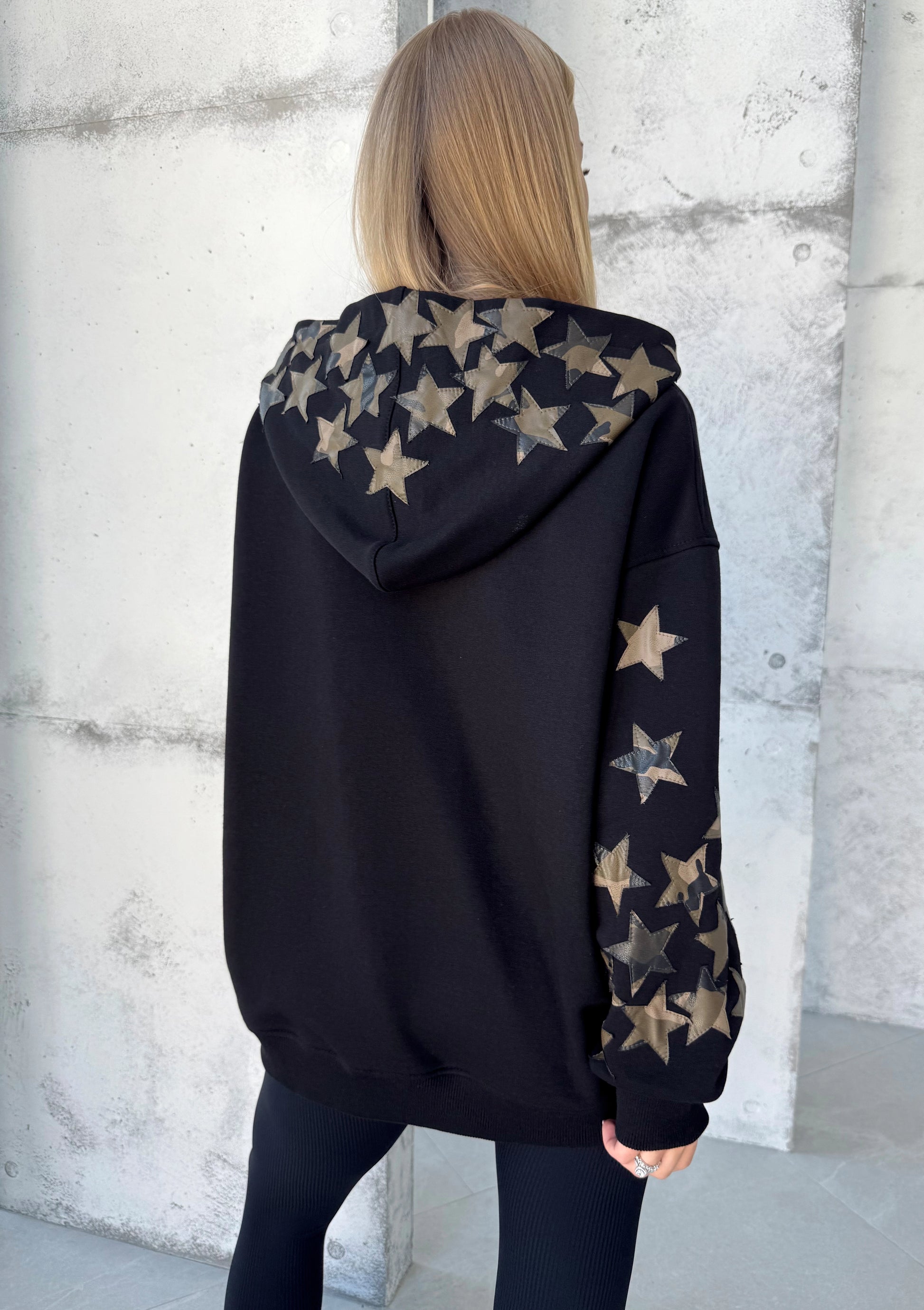 Black cotton-blend hoodie with decorative leather stars and cozy hood