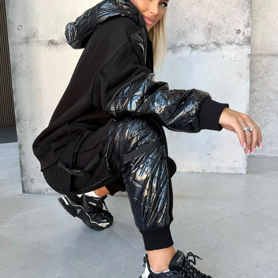 Handmade women’s black jogger set by KRUTYAKOV with subtle rubber patch branding and ergonomic seam details