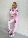 Luxury soft pink women’s tracksuit with sparkling hand-beaded star accents