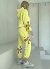 Women’s yellow matching tracksuit set perfect for airport outfits, spring styling, casual wear, and content creation