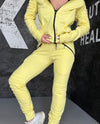 Women’s yellow tracksuit set by KRUTYAKOV with soft cotton blend fabric, comfortable fit, and sporty chic design