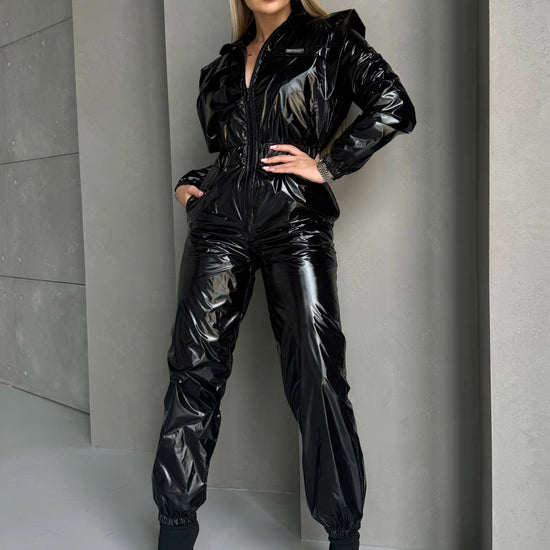 KRUTYAKOV SKYLINE black jumpsuit with premium shine and confident body-contouring fit