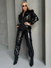 KRUTYAKOV SKYLINE black jumpsuit with premium shine and confident body-contouring fit