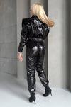 Back view of black shiny jumpsuit with smooth high-shine finish
