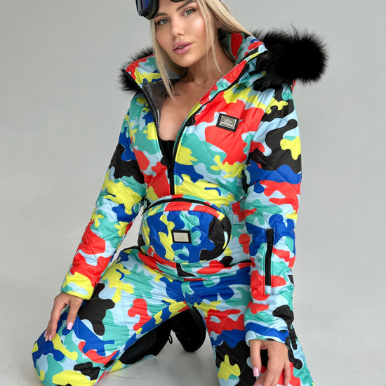 KRUTYAKOV women’s one piece snow suit in colorful designer print for skiing, snowboarding, and après-ski looks