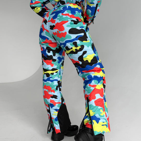 Lifestyle photo of women’s multicolored ski suit for mountain trips, winter vacations, and après-ski fashion