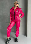 Statement pink one-piece outfit with front zipper and luxury glossy fabric