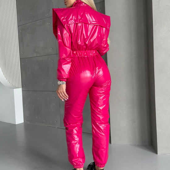 Women’s shiny hot pink jumpsuit with sculpted fitted silhouette and long sleeves