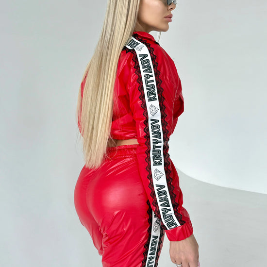 Women’s designer glossy red tracksuit set for fashion photoshoots, streetwear outfits, and everyday styling