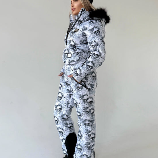 Women’s insulated ski jumpsuit with waterproof-look outer shell, functional pockets, and luxury winter styling