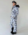 Women’s insulated ski jumpsuit with waterproof-look outer shell, functional pockets, and luxury winter styling