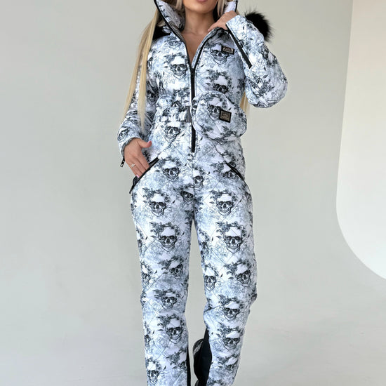 KRUTYAKOV skull print ski suit for women with warm lining, fitted shape, and statement winter fashion look
