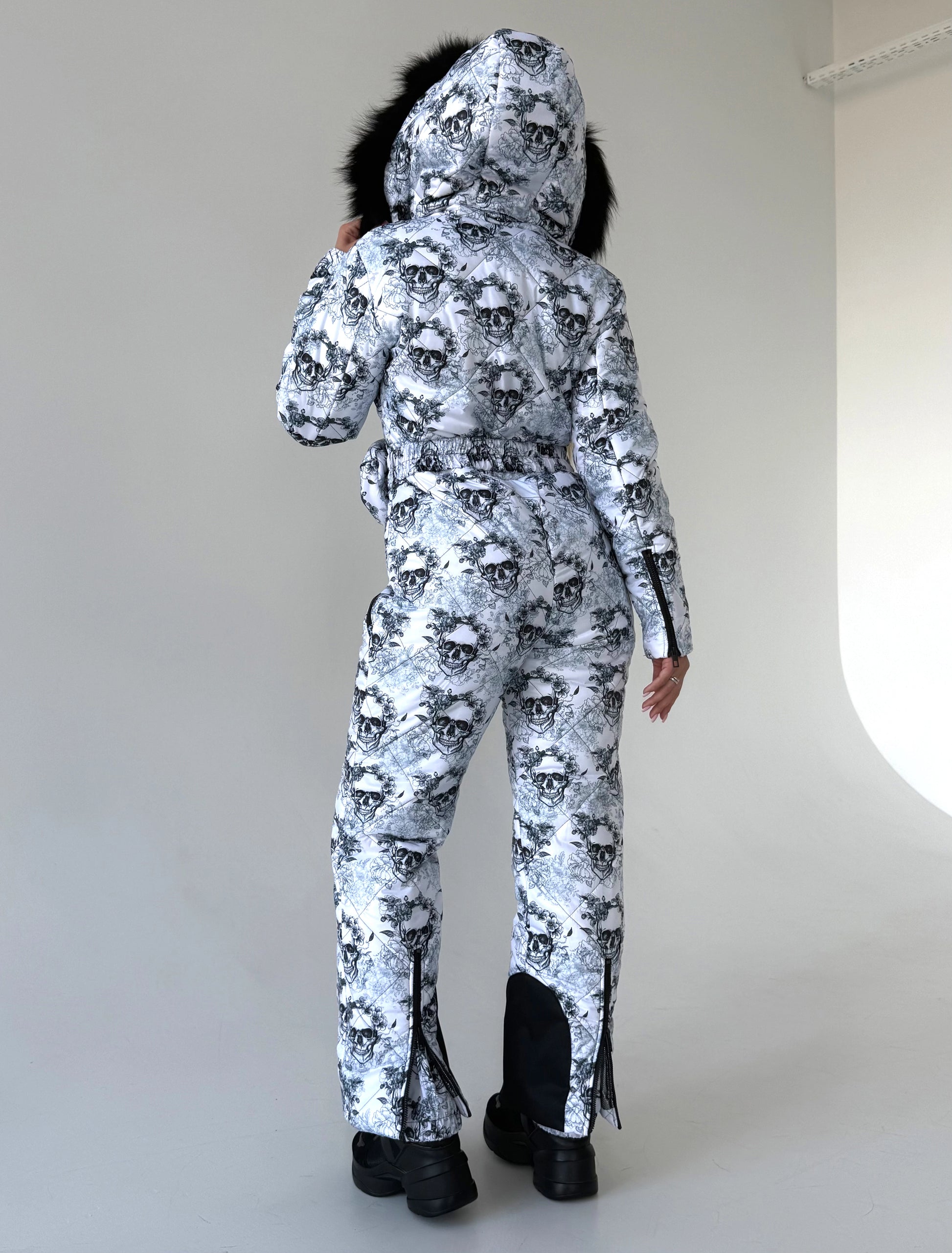 KRUTYAKOV women’s ski overall with artistic skull print, warm insulation, and statement après-ski style