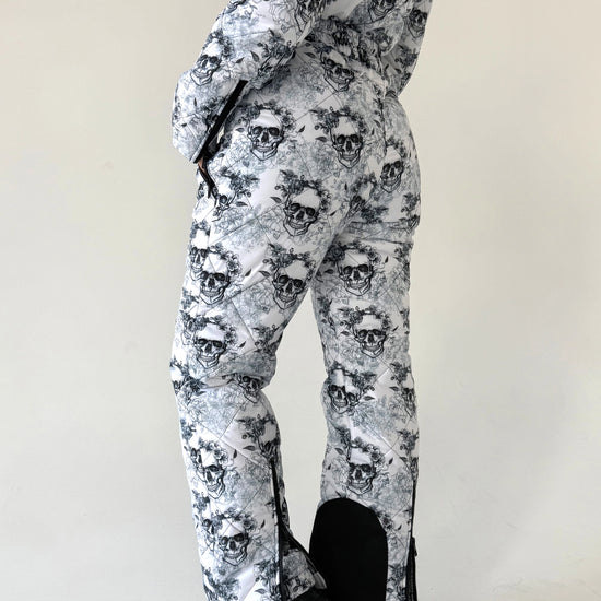 Women’s designer ski suit with HolloSoft 300 insulation, removable fur hood, and premium cold-weather protection
