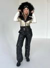 Lifestyle photo of KRUTYAKOV black and gold snow suit with luxury winter look, warm insulation, and premium handmade finish