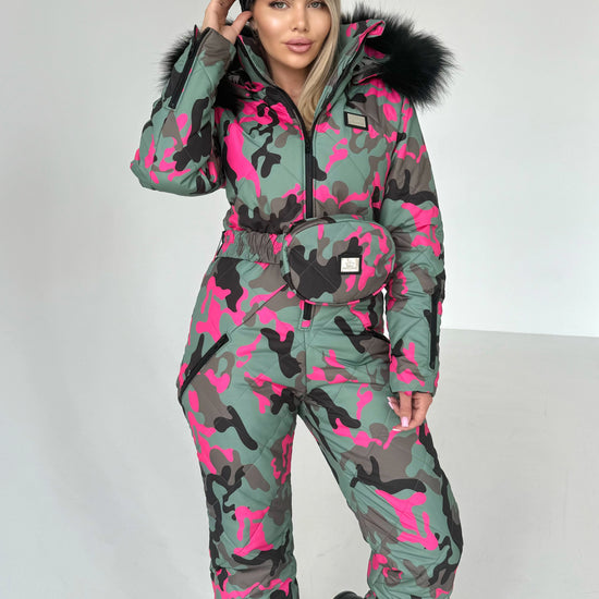 KRUTYAKOV women’s pink camo ski suit styled for skiing, snowboarding, winter travel, and mountain resorts