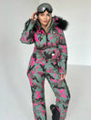 KRUTYAKOV women’s pink camo ski suit styled for skiing, snowboarding, winter travel, and mountain resorts