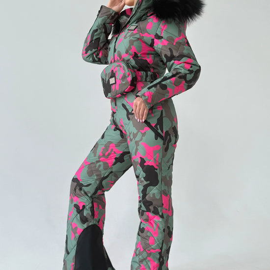 Women’s one piece snow suit VALE with insulated winter design, feminine fit, and bold pink camouflage pattern
