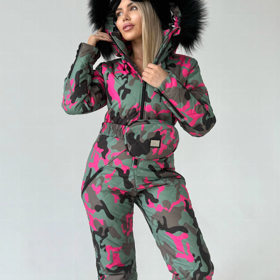 VALE luxury ski suit for women with faux fur hood, matching belt bag, and statement winter fashion look