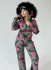 VALE luxury ski suit for women with faux fur hood, matching belt bag, and statement winter fashion look