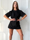Black cotton T-shirt for women with decorative metal chain details and relaxed elongated silhouette