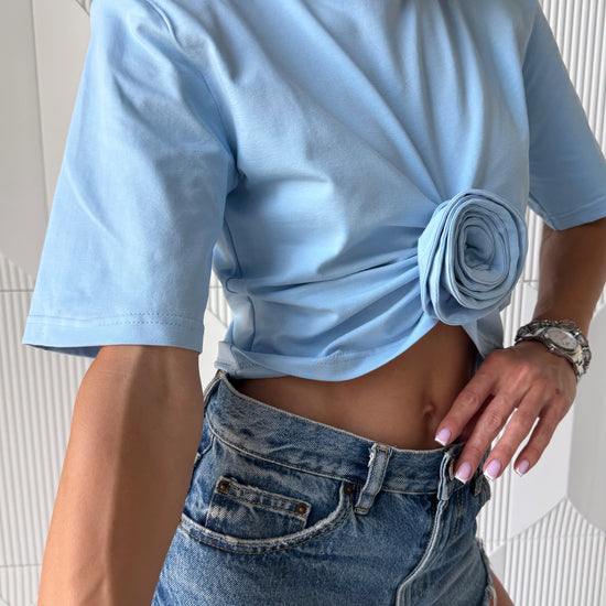 Sky blue women's t-shirt with signature rose detail and cropped silhouette – premium stretch cotton fashion top