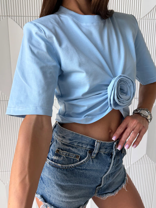 Sky blue women's t-shirt with signature rose detail and cropped silhouette – premium stretch cotton fashion top