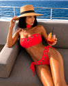 Coral three-piece bikini set with choker, bandeau top and tie-side bottoms for beach and poolside looks