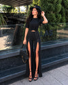 Designer black slit trousers for women with dramatic silhouette and premium fabric