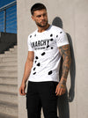 Close-up of men’s white designer T-shirt with ANARCHY velvet-effect print and layered cut-out design