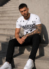 Back view of men’s white ANARCHY T-shirt with black decorative cut-out details