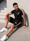 KRUTYAKOV men’s black t-shirt and shorts summer set with branded logo tape, worn with white sneakers for a streetwear vacation look